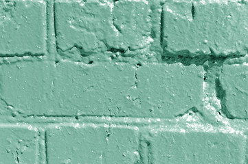 Wall Mural - Painted brick wall close up. Abstract background green color toned