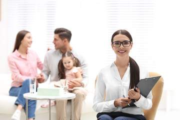 Wall Mural - Professional psychologist and happy family in office