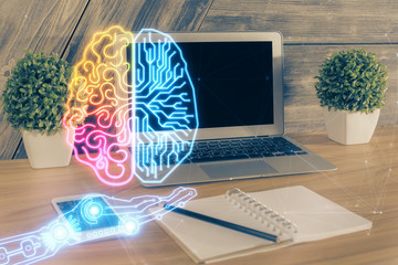 Multi exposure of work table with computer and brain hologram. Brainstorm concept.