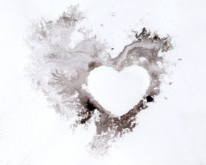 Watercolour splashes heart on white paper background.