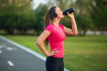 Sticker - beautiful young woman in sportswear in a summer park