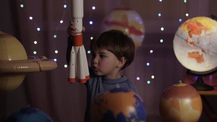 Space Travel Game Inspiration Spaceship. Little Kid Boy Astronaut Launching Toy Rocket From Spaceport Through Planets. Child Dreamer Playing With Toy Space Rocket Flying Among Planets. SLOW MOTION.