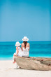 © travnikovstudio - Beautiful mother and daughter at the beach enjoying summer vacation.