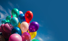 Multi-colored Balloons On Blue Sky Background