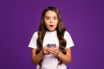 Poster - Close-up portrait of her she nice attractive lovely cute wondered astonished wavy-haired girl using cell 5g app reading news isolated on bright vivid shine vibrant purple violet lilac color background