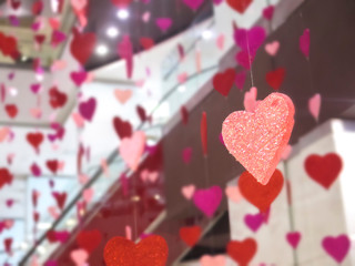 red hearts hanging in a shopping mall