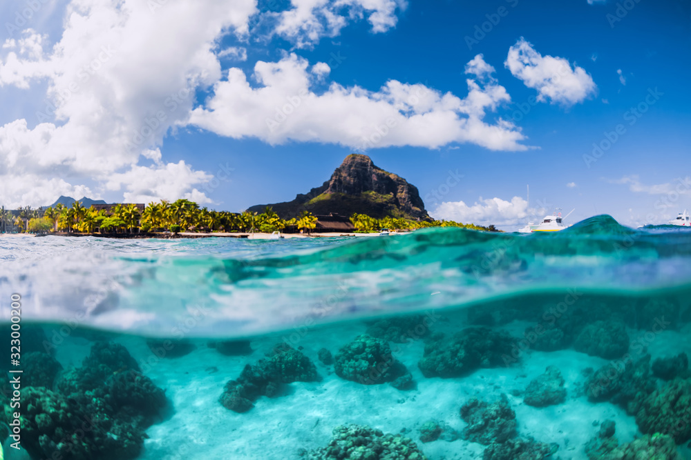 Blue ocean underwater and Le Morne mountain in Mauritius. - obrazy, fototapety, plakaty 