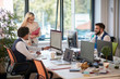 © luckybusiness - group of three colleagues in open space office. teamwork, success, modern business