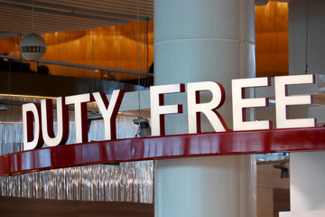 Duty free sign in the airport building. The tax-free area symbol