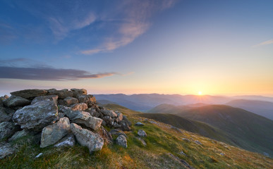 Sticker - A bright sunset sky over the mountains of the Lake District from the summit og Ramspgill Head with views of The Knott and Rest Dodd below.