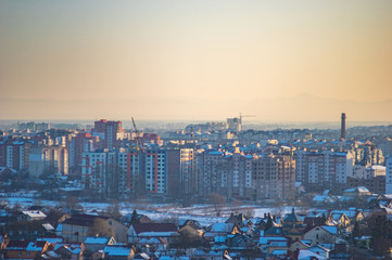 Winter city houses in haze