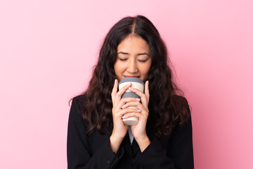 Wall Mural - Mixed race business woman holding coffee to take away over isolated pink background