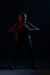 © Augustas Cetkauskas - Kid playing basketball isolated on black background in mixed light