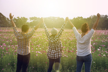 Canvas Print - man and woman with arms raised in the air