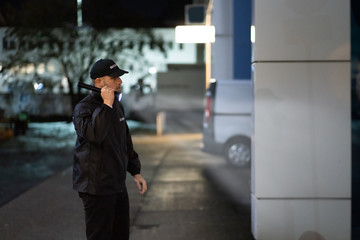 security guard walking building perimeter