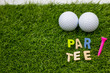 Golf party invitation par tee golf ball with colorful tee on green grass