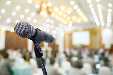 Microphone over the blurred business people forum Meeting Conference Training Learning Coaching Concept, Blurred background.