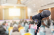 © nattanan - Microphone over the blurred business people forum Meeting Conference Training Learning Coaching Concept, Blurred background.