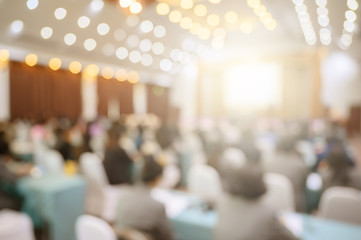 Blurred background of business people in conference hall or seminar room.