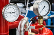 © OlegDoroshin - pressure manometer for measuring installed in water or gas systems. focus on the pressure manometer. Plumbing equipment, fittings, pipes, faucets, etc.