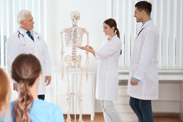 Canvas Print - Medical students having lecture in orthopedics at clinic