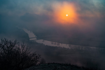 Wall Mural - Sunrise time on Radobyl hill over valley of river Labe and Litomerice town