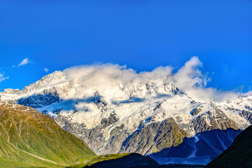 Sticker - The high mountains at the top are snow and clouds. In the morning blue skies in Mount Cook National Park, Aoraki, New Zealand