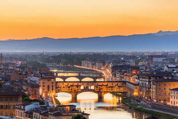 Poster - View of Florence at sunset with the Ponte Vecchio bridge over the Arno River