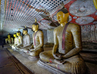 Buddha statue inside Dambulla cave temple on February 8, 2020 in Dambulla, Sri Lanka. Cave II Maharaja Viharaya. Major attractions are spread over 5 caves, which contain statues and paintings.