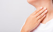 © sorapop - Asian beautiful woman Sore Throat or thyroid gland problem her useing Hand Touching Ill Neck
