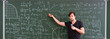 © Mihail - teacher of young professor explains the law of physics for students on the lesson, standing near the blackboard