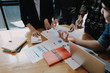 © Natee Meepian - Business People Planning Strategy Analysis from financial document report, Office Concept