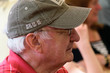 Elderly man wearing baseball cap