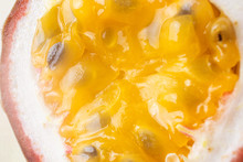 Passion Fruit Pulp Close-up. Macro Photo. The Concept Of Exotic Fruits, Wholesome Organic Food, Vegetarianism. Light Pastel Background.