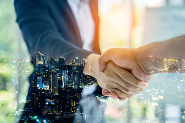 Canvas Print - Double exposure worker hand shake teamwork brainstorming with innovation business. concept success investment.Business People Handshake Greeting Deal Concept.