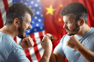 A trade war between China and the United States, two men are preparing for a fight against the backdrop of the American and Chinese flag. Truce, war, sanctions, business.