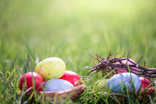 Easter Eggs In Grass Background With Crown Of Thorns