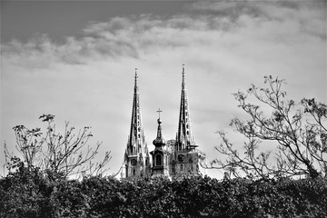 Cathedral towers high in thee sky with panorama black and white