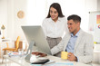 © New Africa - Professional designers working together in modern office