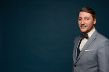 Handsome positive man in elegant formal clothes