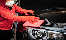 Car Wash Cleaning Concepts . Auto Service Staff Cleaning Car With Microfiber Cloth In Interior Car Console