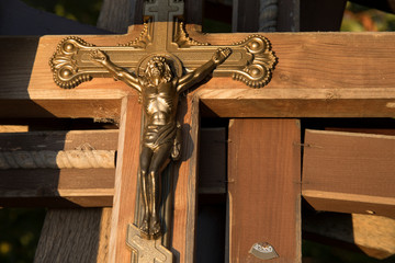 wooden Crosses with crucifix Jesus at cemetery yard