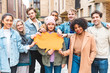 © william87 - Multicultural group of friends holding an empty orange thought bubble