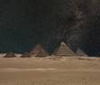 The Giza pyramid complex under night starry sky