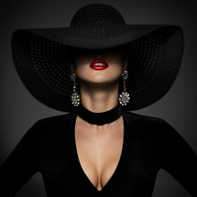 Fashion Model In Sexy Black Dress, Elegant Woman Beauty In Wide Broad Brim Hat Covered Face