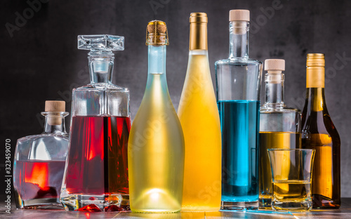 Cuadros en Lienzo Carafe and bottles of assorted alcoholic beverages.