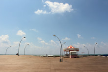 The Wooden Promenade And The Notorious Carousel Of The Old Tel Aviv Port On A Sunny Day With Blue Sky And Few Clouds