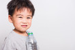 © sorapop - Closeup Asian face, Little children boy drinking water from Plastic bottle