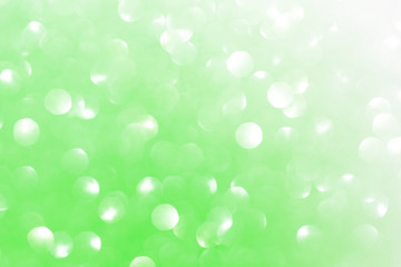 Abstract soft green background with bokeh blurred glister