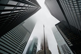 Fototapeta Sypialnia - Scenic Toronto financial district skyline and modern architecture. Skyscrapers, fog and clouds concept.